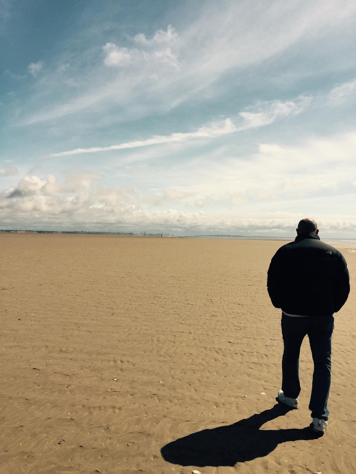 A walking therapy session on an open beach along the Almería coast